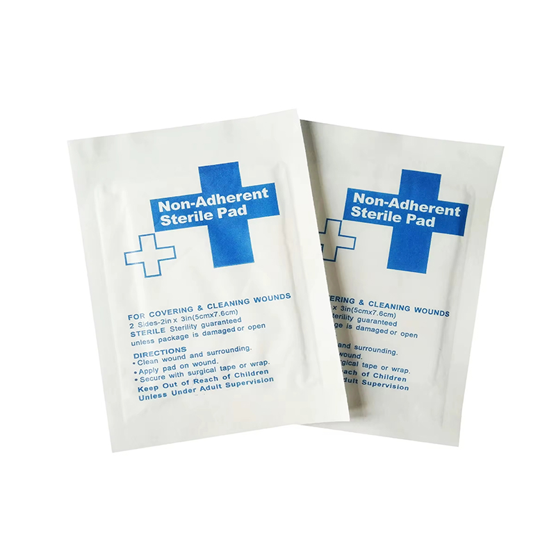 Gauze Retention Fixation Pad Non-Adherent Contact Layer with Absorbent Core